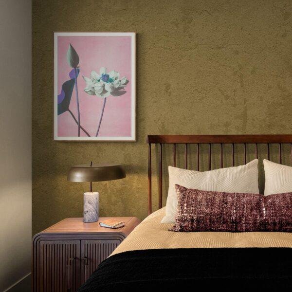 Cozy bedroom with floral art print above nightstand