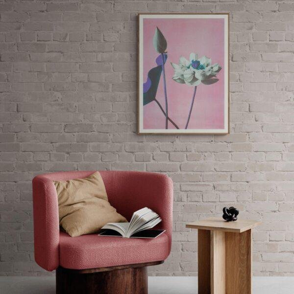 Cozy reading nook with pink armchair and floral wall art