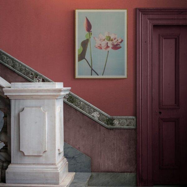 Elegant staircase with lotus flower art on red wall