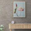 Framed lotus flower print above modern wooden console