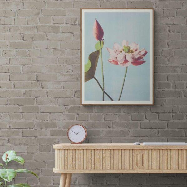 Framed lotus flower print above modern wooden console