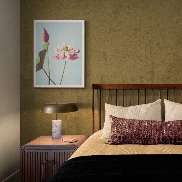 Elegant bedroom with lotus flower art and warm lighting