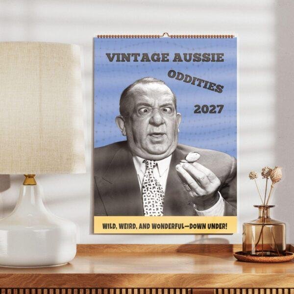 Vintage Aussie Oddities 2027 wall calendar on wooden shelf