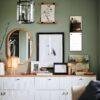 Stylish green bedroom dresser with gallery wall and mirror