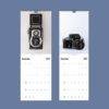 2027 wall calendar featuring vintage Reflekta II and Nikon cameras