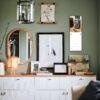 Stylish green living room with gallery wall and credenza