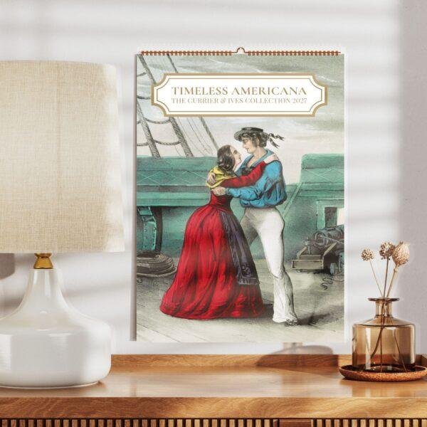 Currier and Ives 2027 wall calendar on wooden shelf