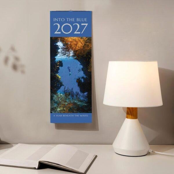 2027 Into the Blue underwater calendar hanging on wall