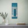 2027 Doors of the World wall calendar hanging above desk