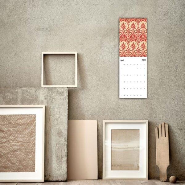 April 2027 wall calendar with red damask pattern