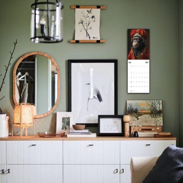 Stylish green bedroom dresser with eclectic gallery wall decor