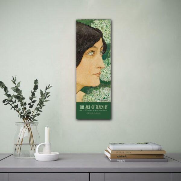 Art Nouveau wall calendar featuring serene woman portrait with flowers