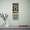 2027 Fiat 500 wall calendar hanging above modern console