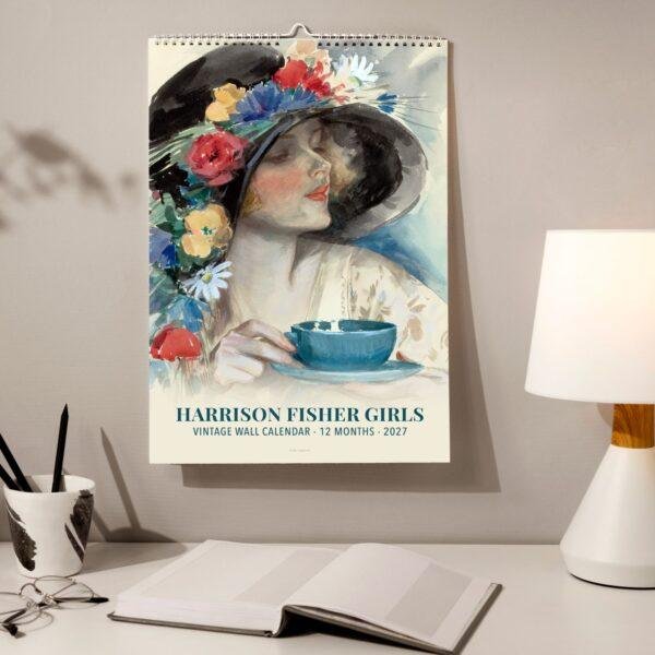 Harrison Fisher Girls 2027 vintage wall calendar on desk