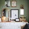 Stylish green bedroom wall with gallery art and sideboard