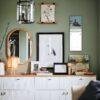 Stylish green room with gallery wall and white sideboard