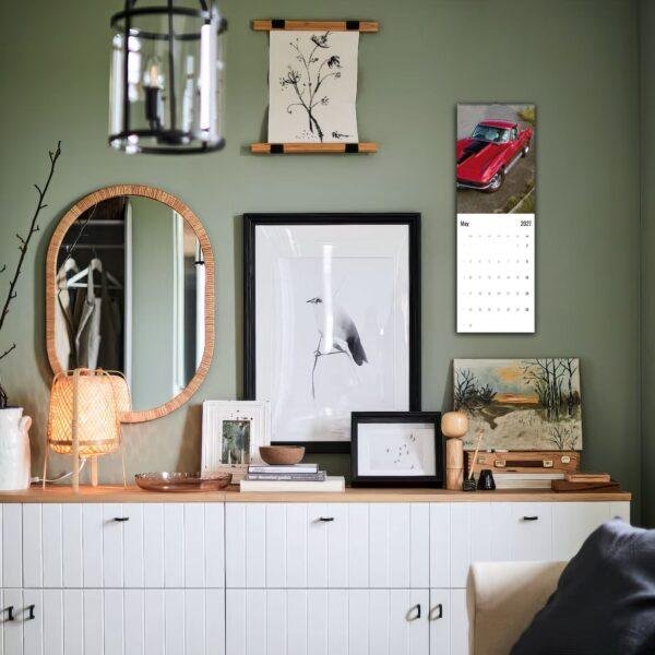 Stylish green room with gallery wall and white credenza