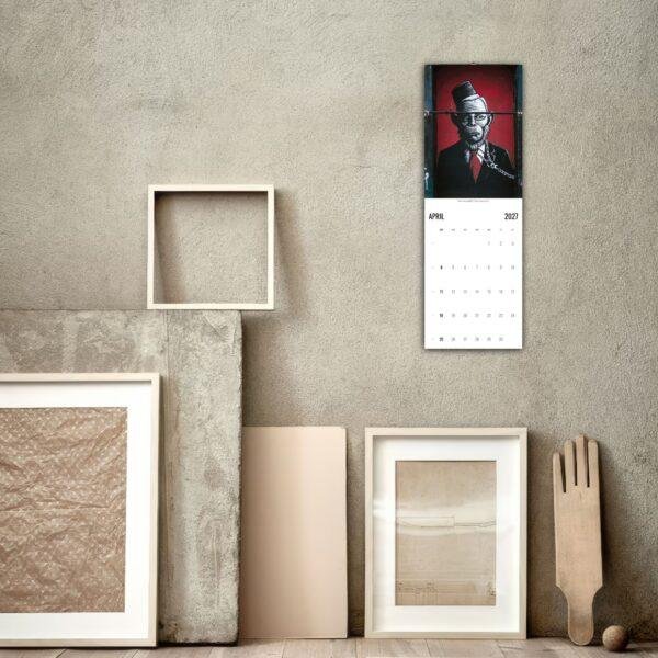 April 2027 wall calendar with street art illustration displayed