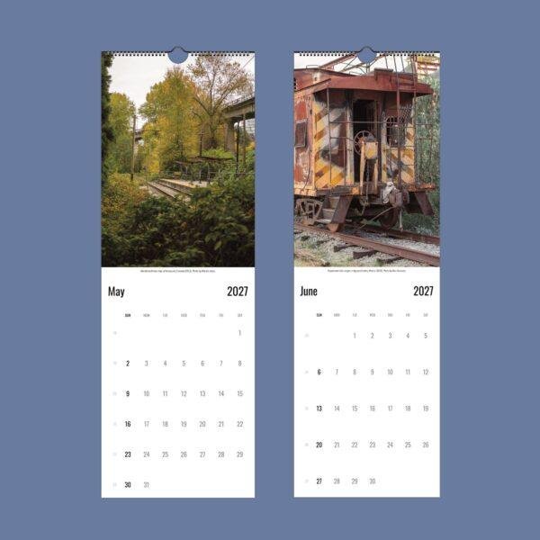 2027 wall calendar showing May and June with abandoned trains