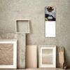 2027 wall calendar with floral art hanging on textured wall